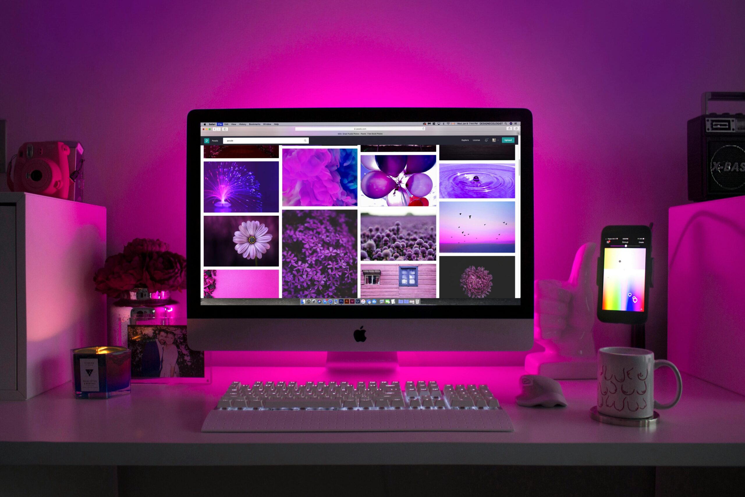 pexels-photo-1779487-1779487 Modern desk setup with neon lighting and a desktop computer displaying colorful images.